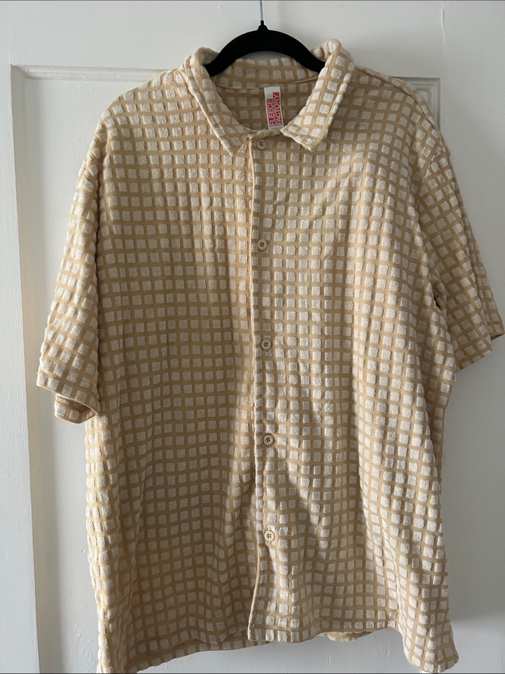 Beige Grid Short-Sleeve Button-Up Shirt and matching shorts.